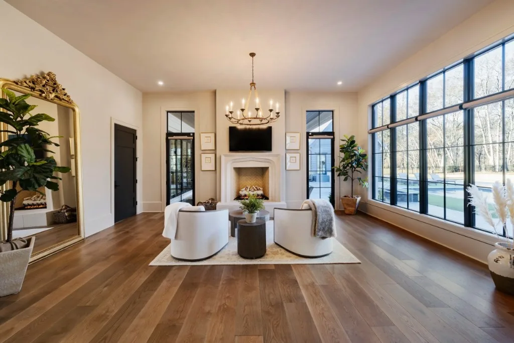 Berkeley Lake — living room with steel-framed windows and fireplace