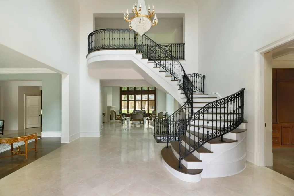 Paces Ferry Estate — two-story foyer with curved iron staircase